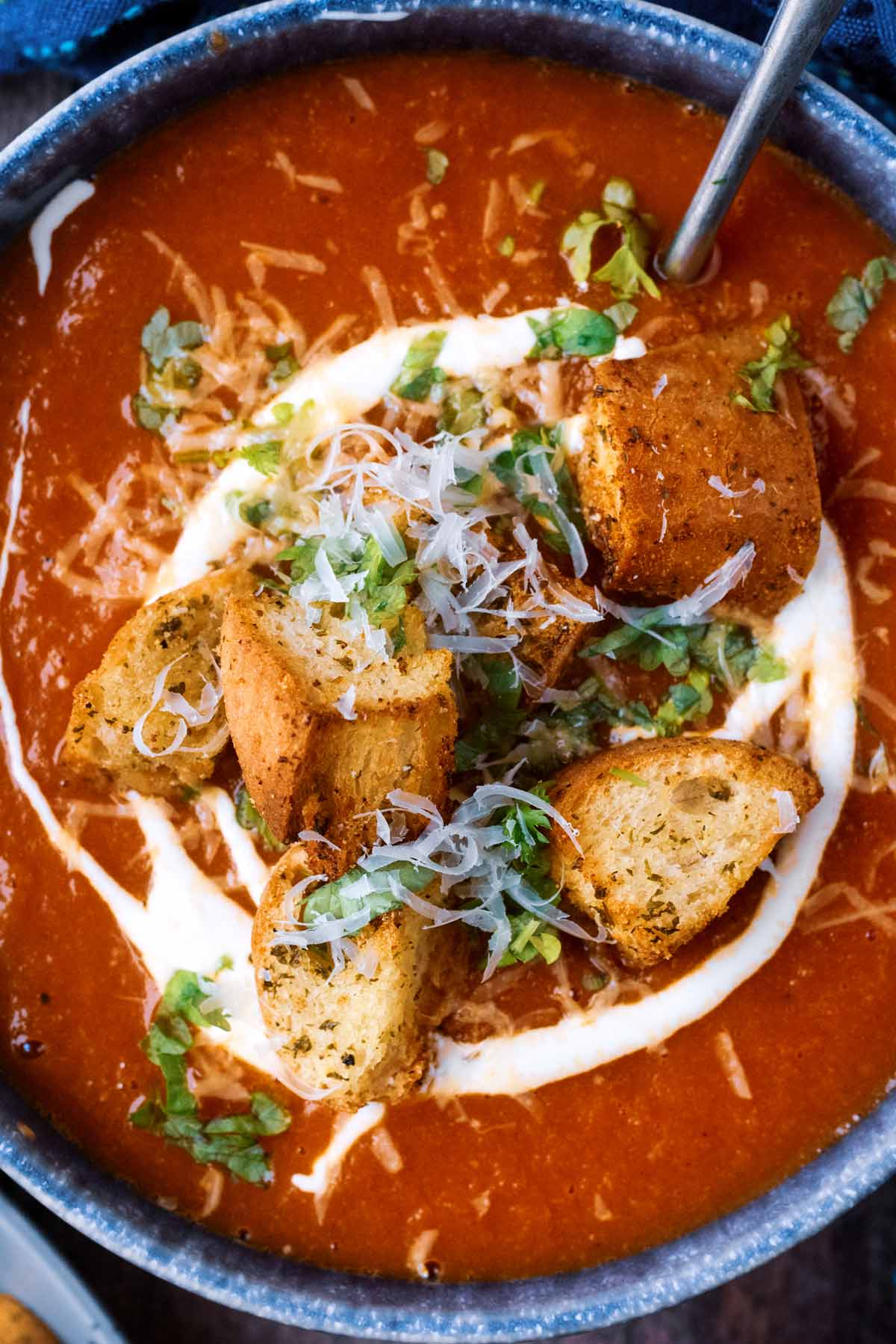 Tomato soup topped with cream and chunky croutons.