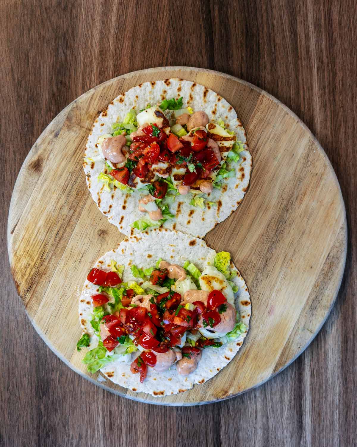 Assemble tacos on a round serving board.