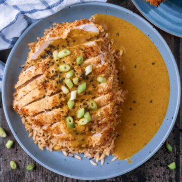 Air fryer chicken katsu in a bowl with rice and katsu sauce.