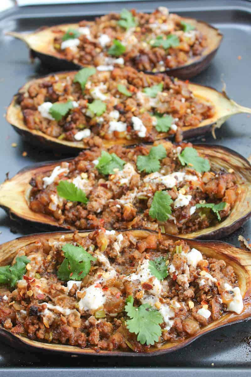 Aubergine halves stuffed with cooked lamb mince, cream and coriander.