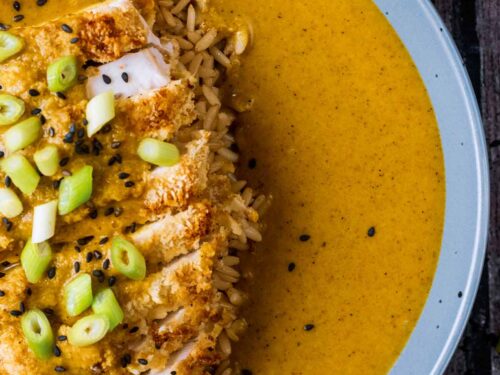 Sliced breaded chicken covered in katsu curry sauce.
