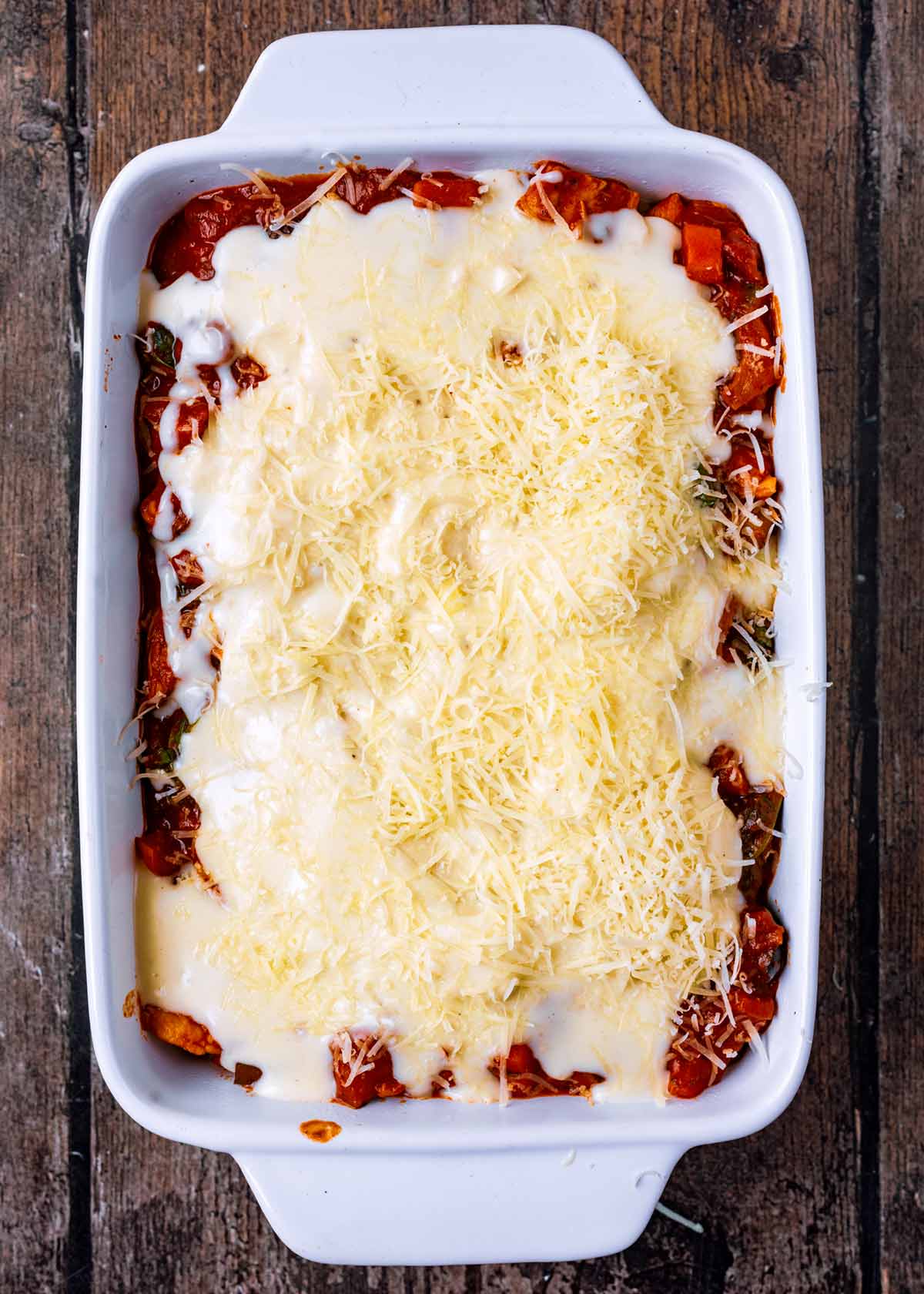 More ragu, bechamel and grated cheese added to the dish.