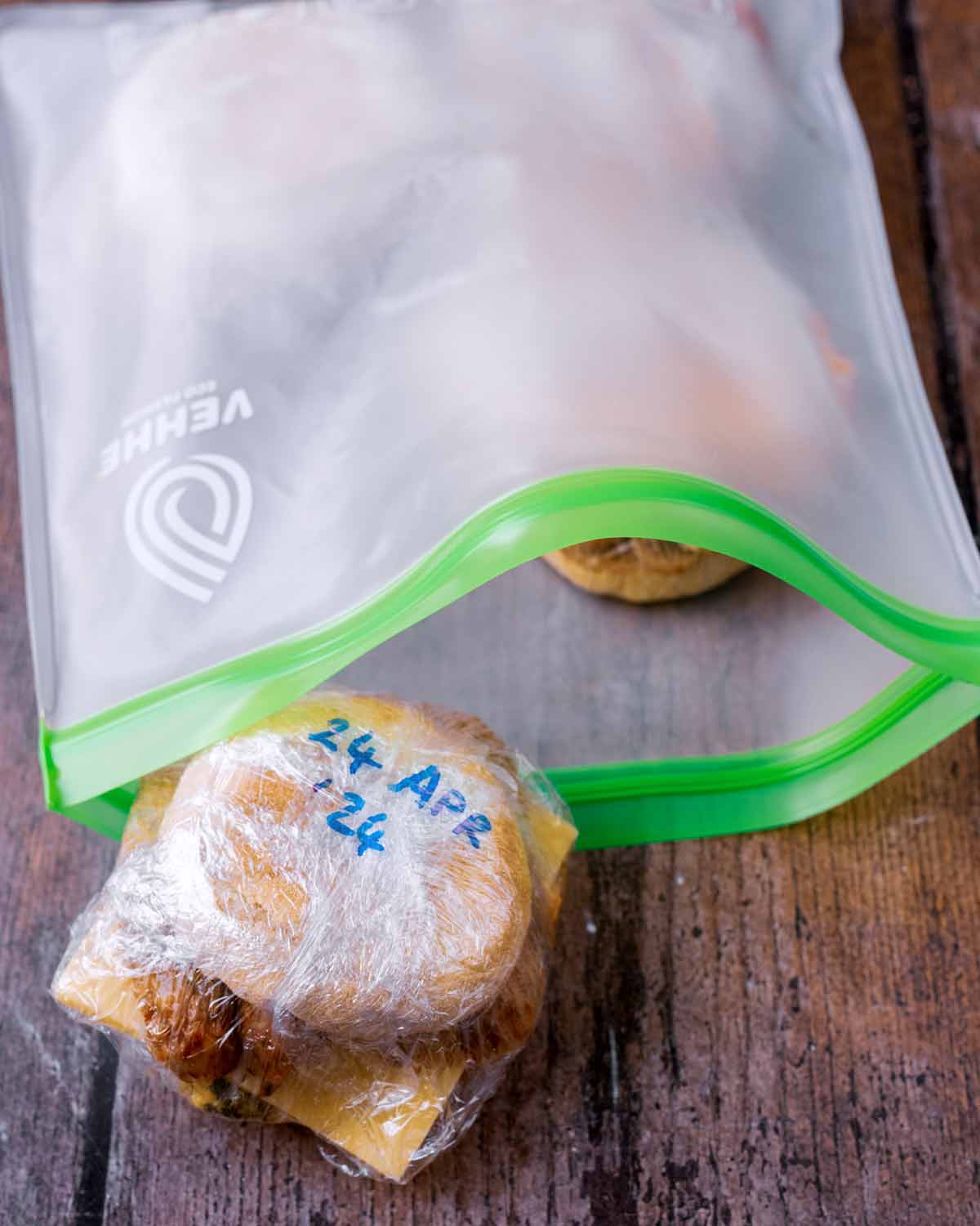 A resealable freezer bag with breakfast muffins in it.