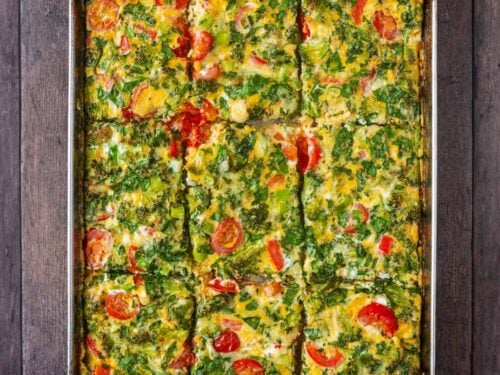 Sheet pan eggs on a wooden surface.