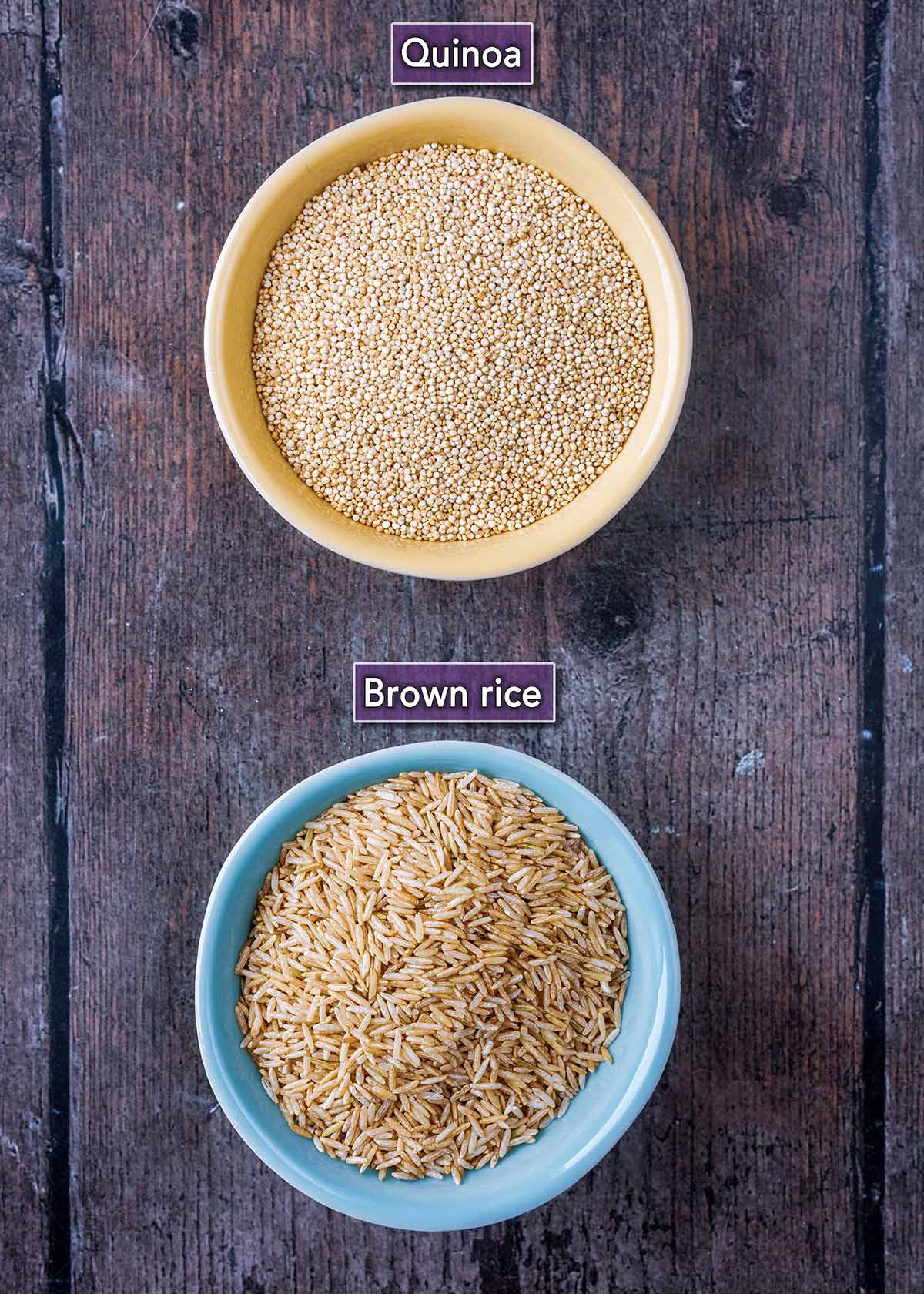 A bowl of uncooked quinoa and a bowl of uncooked brown rice.