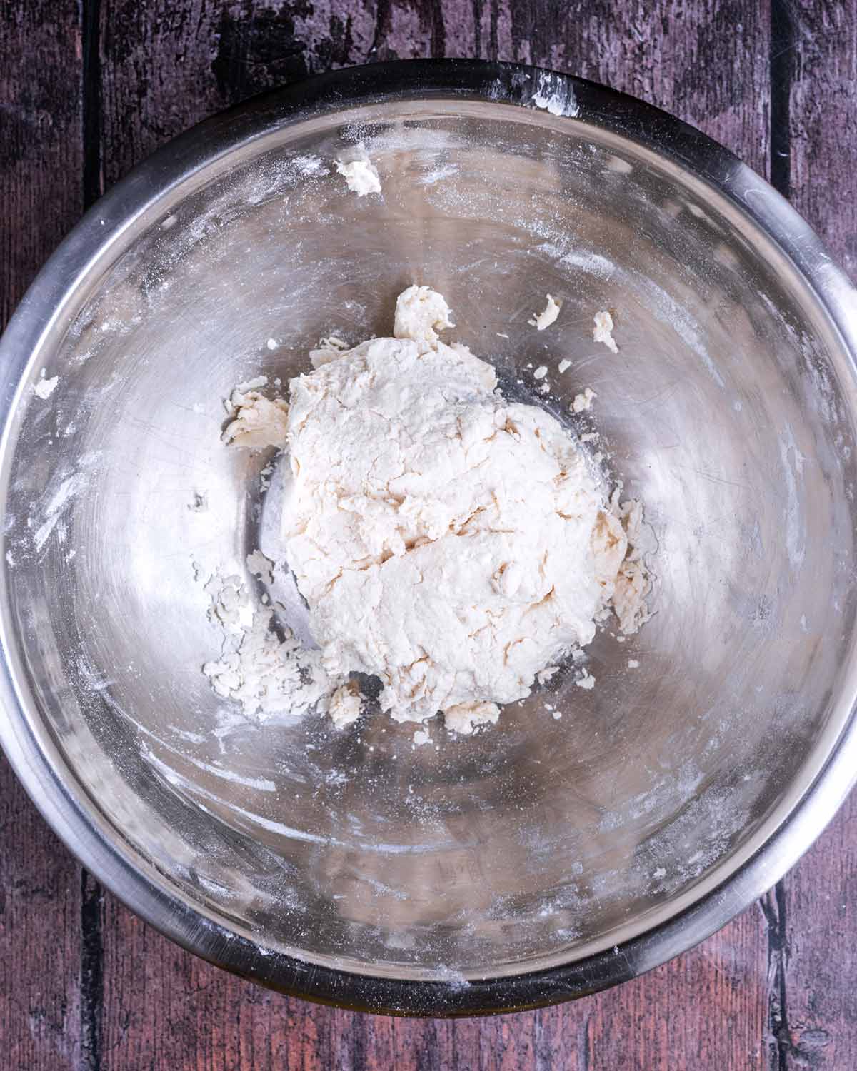 A ball of dough in the mixing bowl.