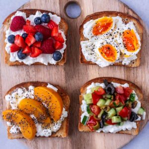 Four slices of cottage cheese toast each with a different topping.