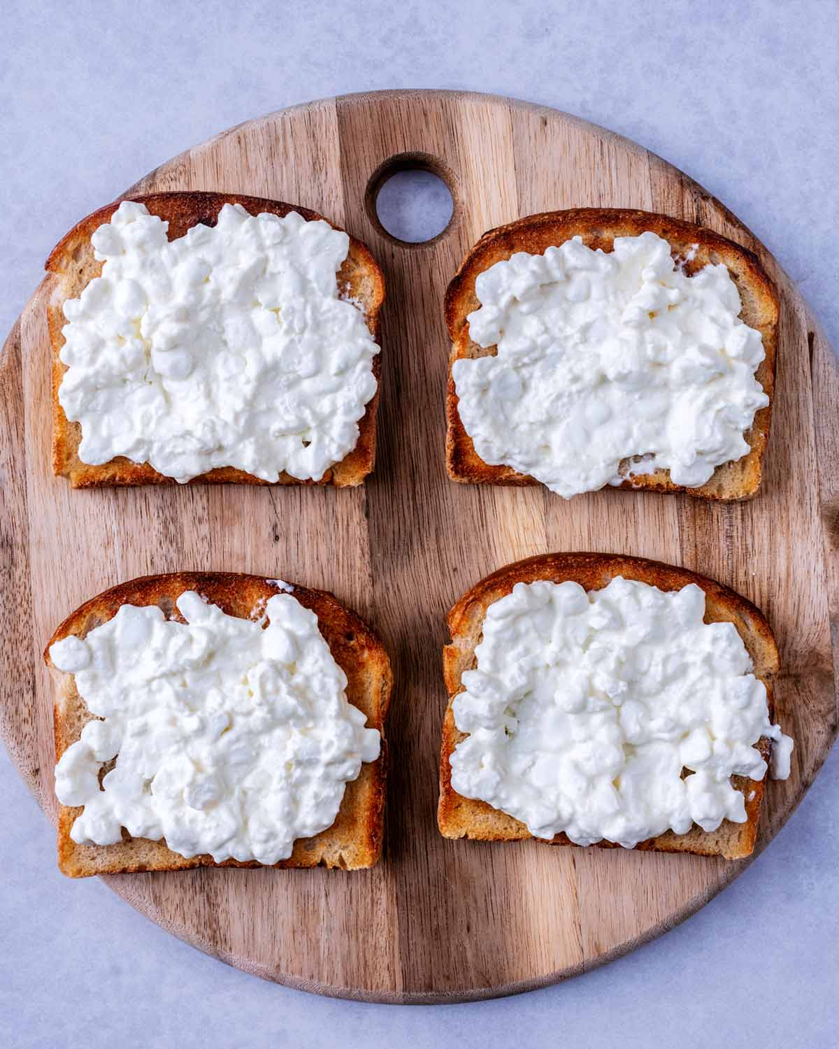 Cottage cheese spread over the toast.