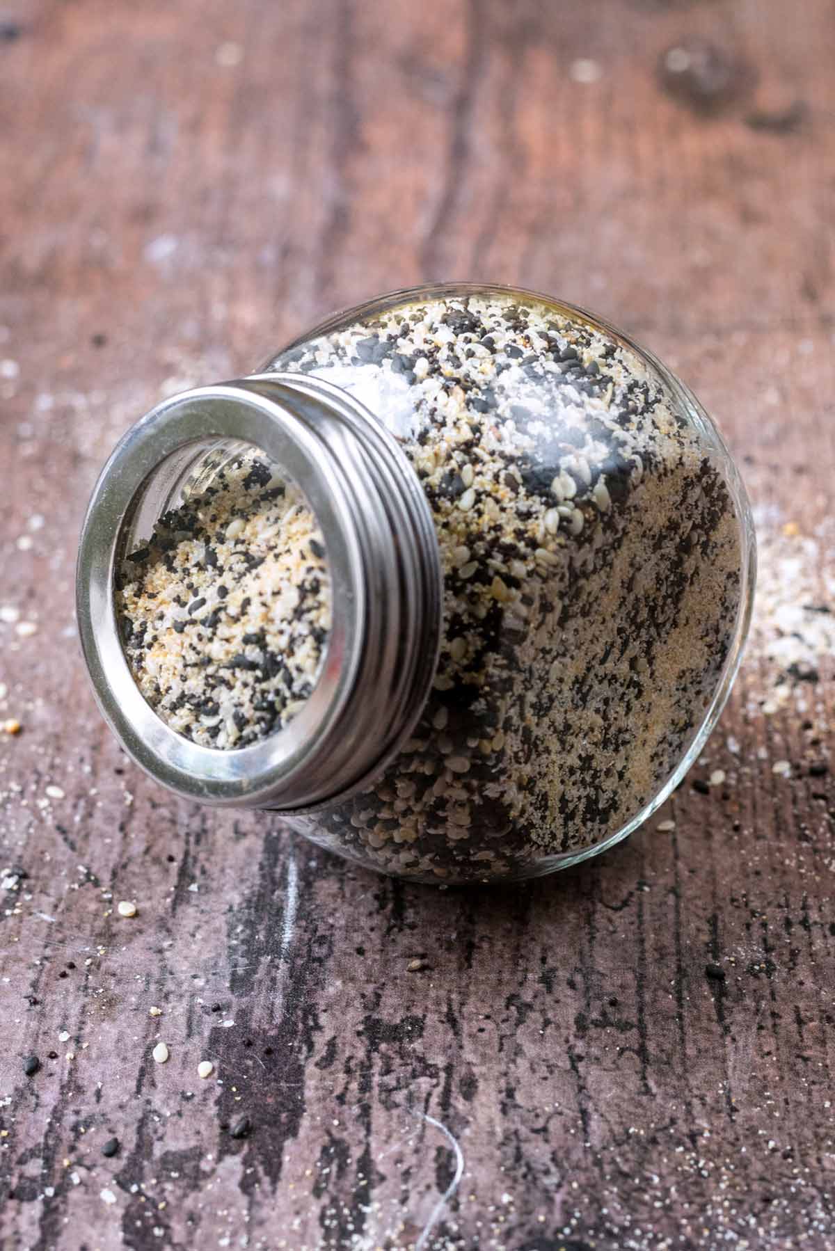 Bagel seasoning in a glass jar with a lid on.