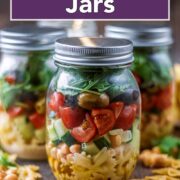 Pasta salad jars with a text title overlay.