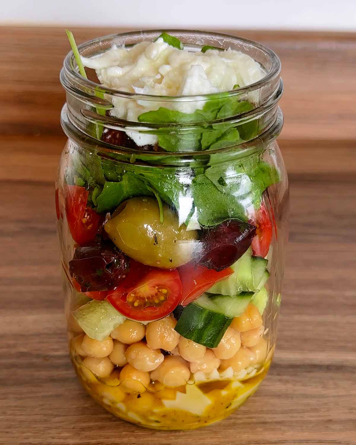 Sun-dried tomatoes and mozzarella cheese added to the jar.