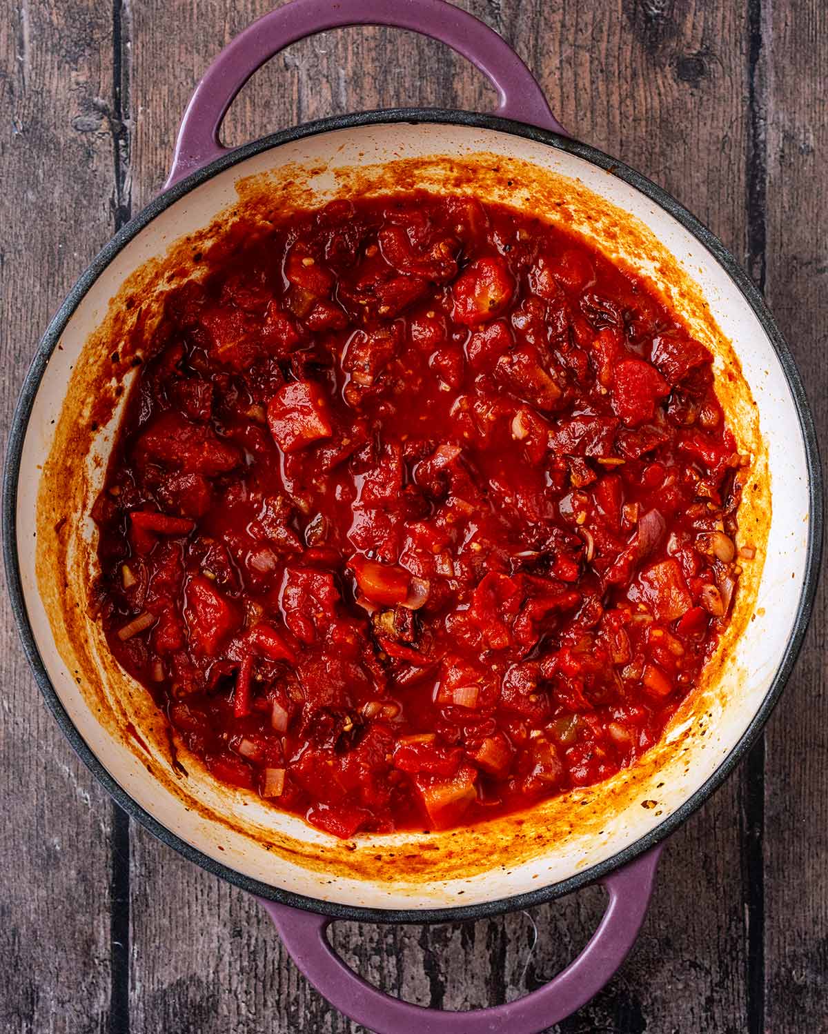 Chopped tomatoes added to the pan.