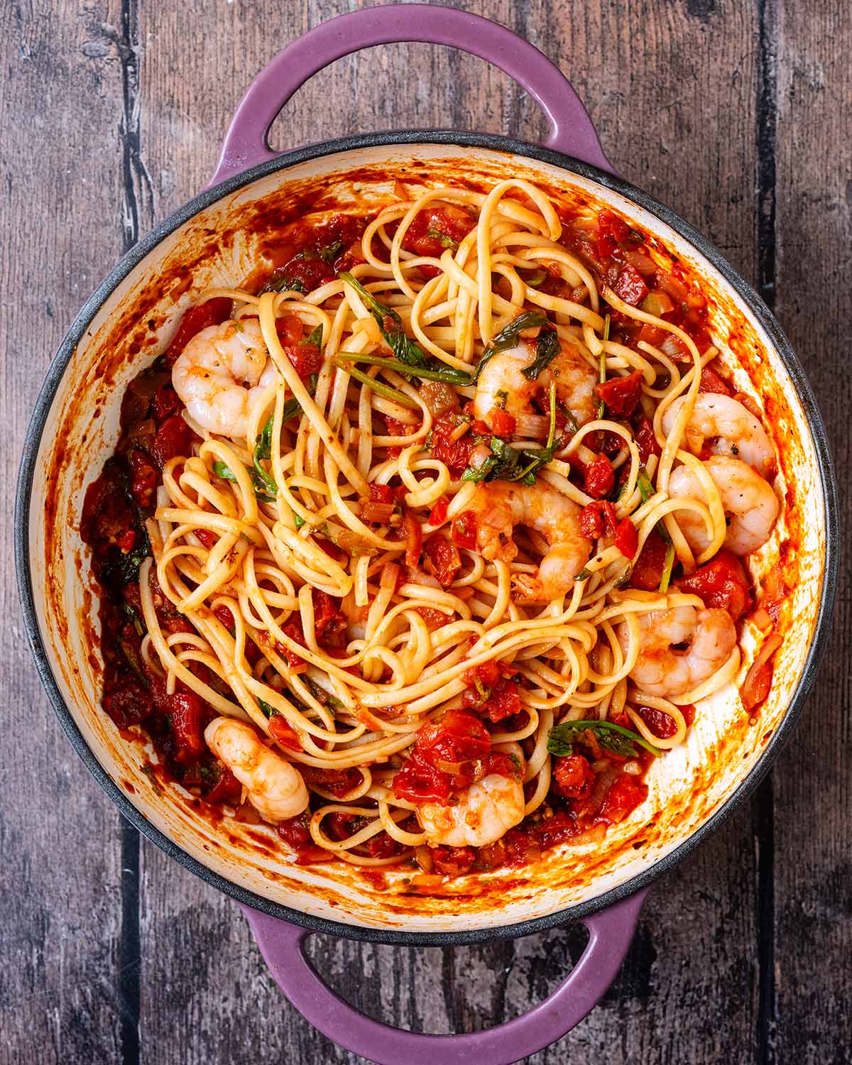 Cooked linguine added to the pan.