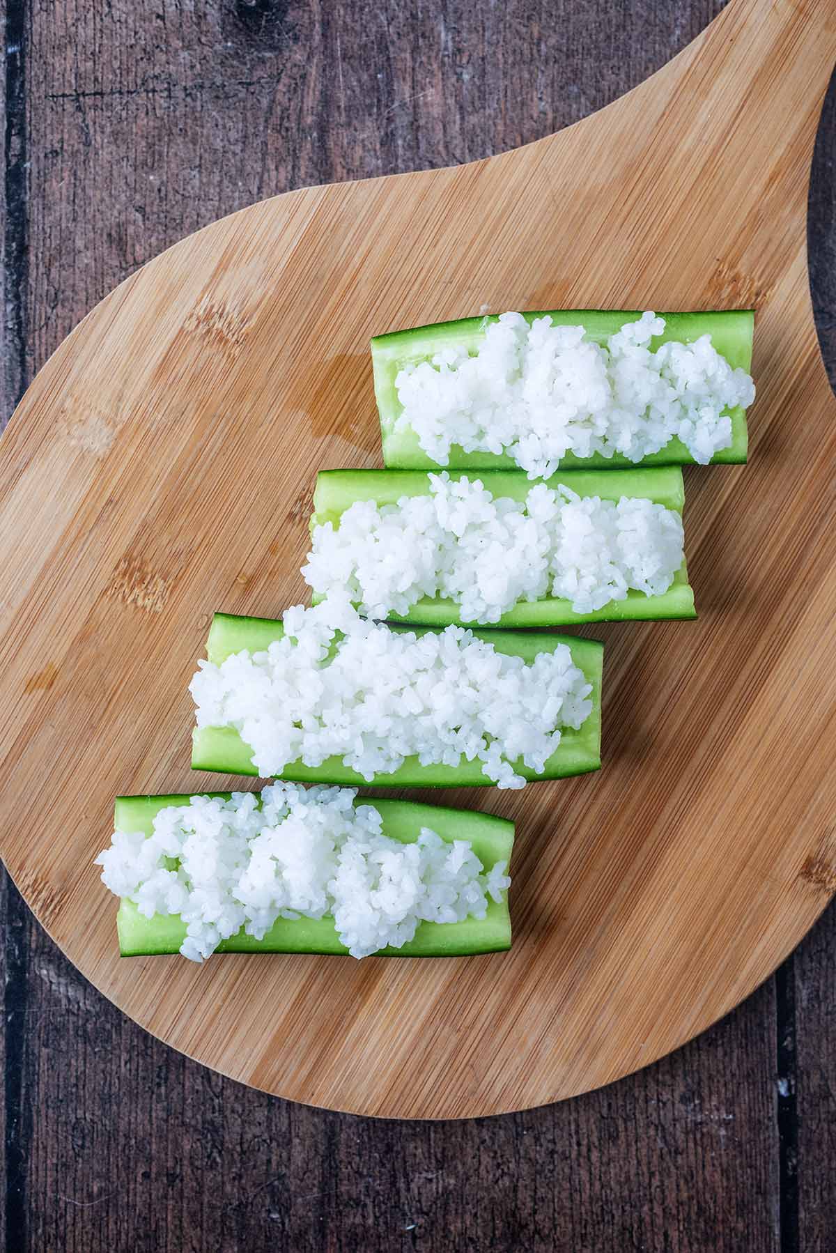 The quartered cucumber filled with sushi rice.