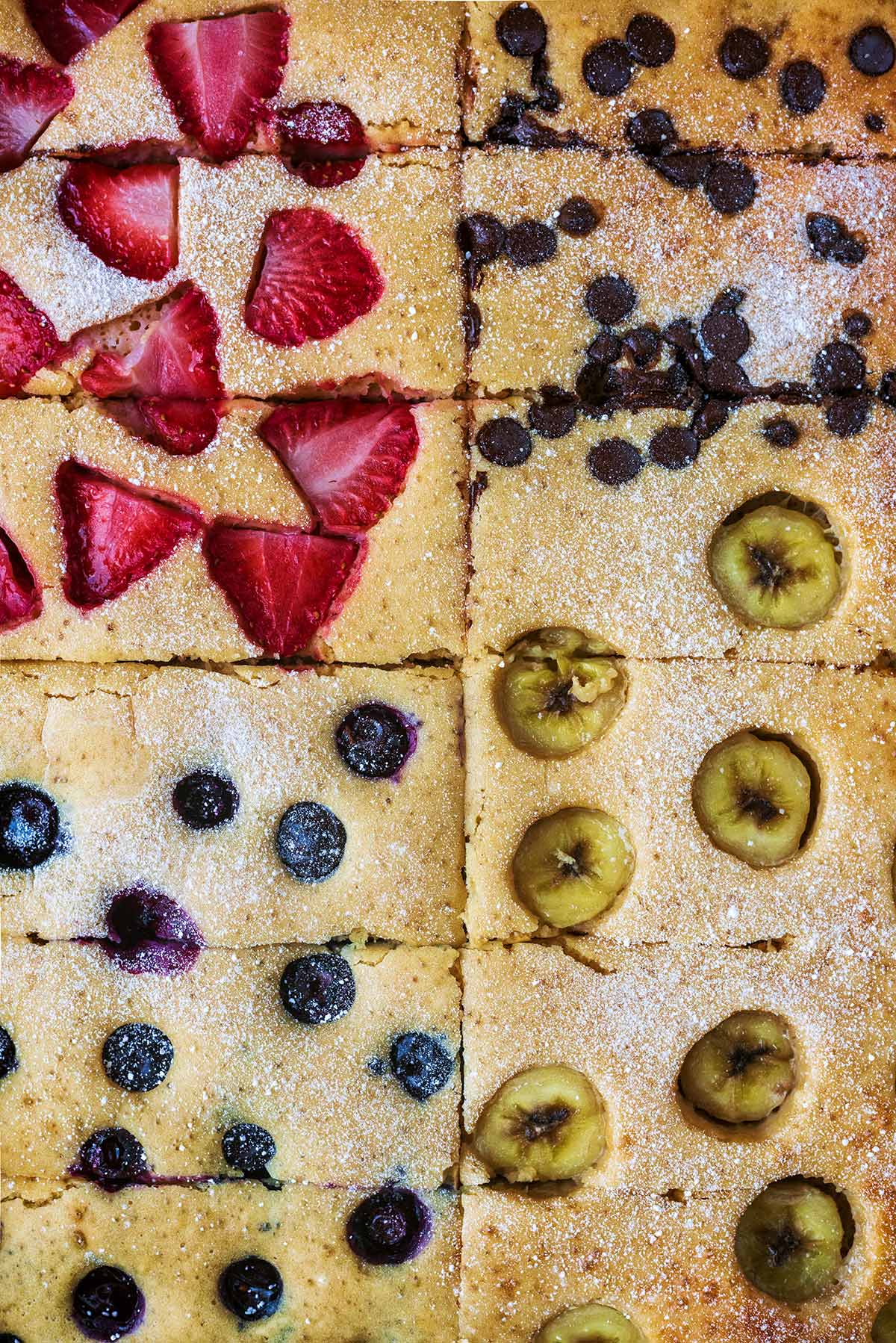 Sheet pan pancakes cut into twelve rectangular bars.