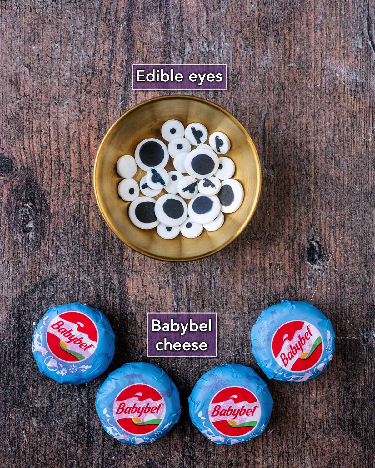 Four Babybel cheeses and a bowl of edible eyes, both with text overlay labels.