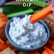 A bowl of Greek yogurt ranch dip with a text overlay title.