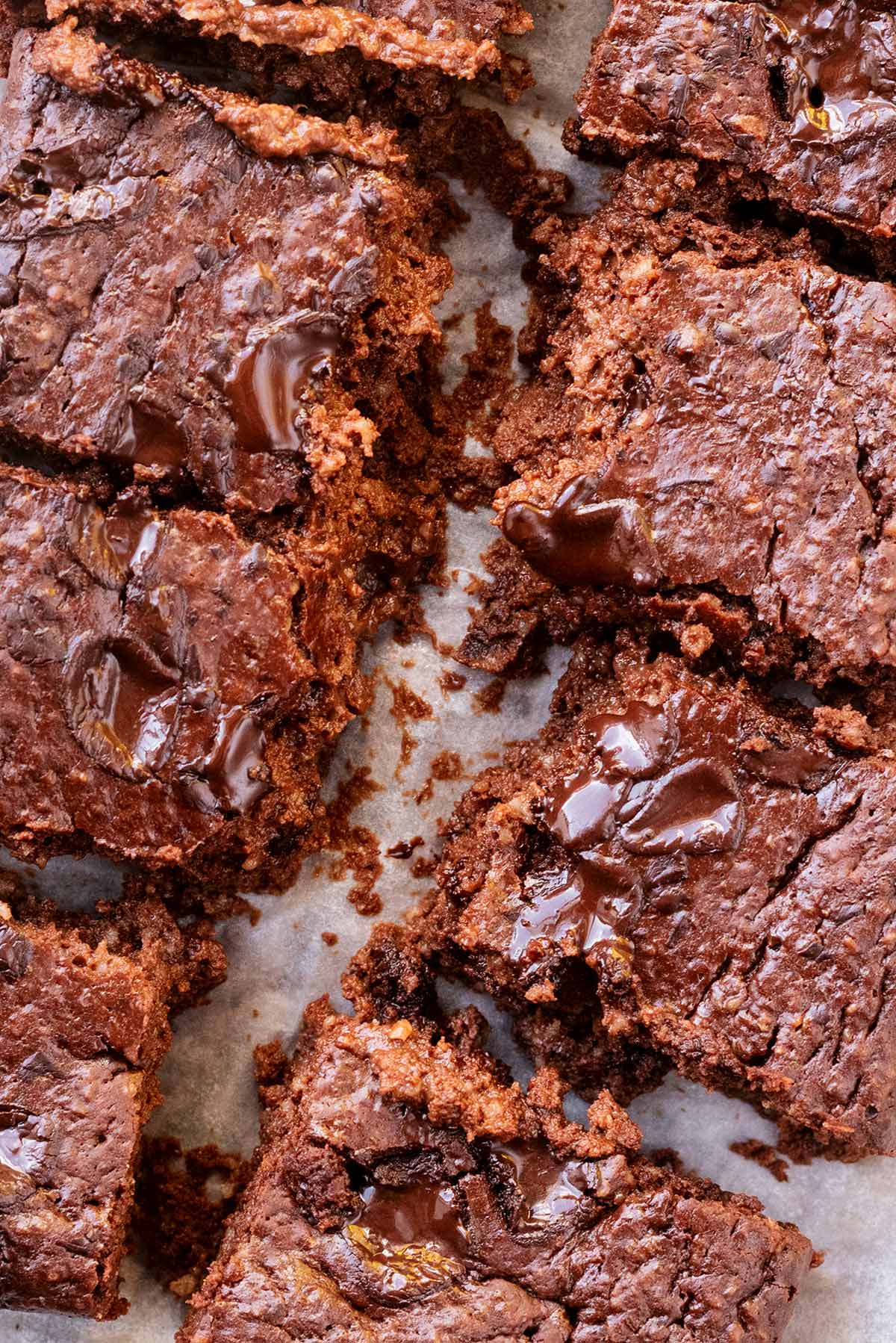 Chocolate brownies cut into squares, revealing their fudgy inside.