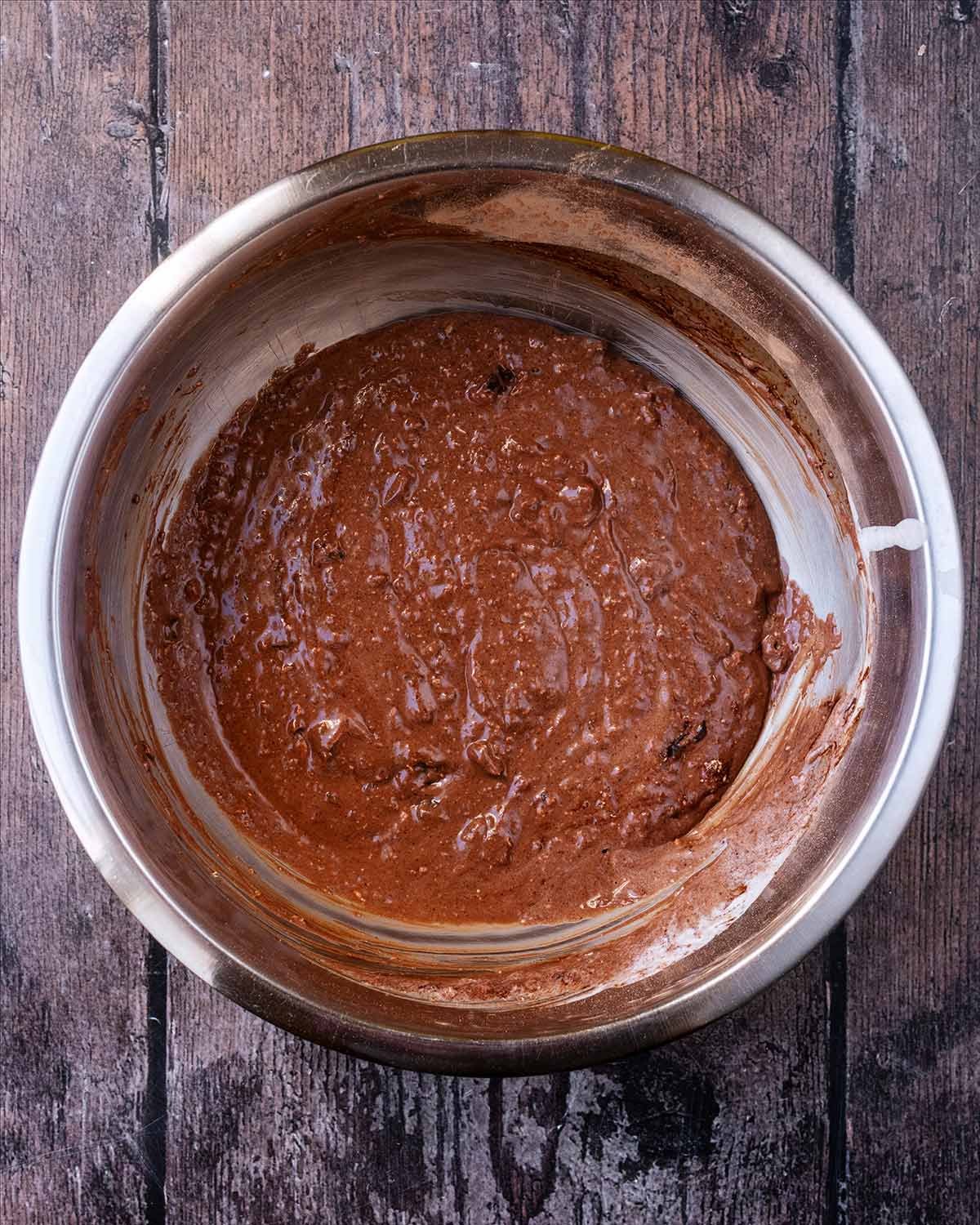 Chocolate brownie batter in a mixing bowl.