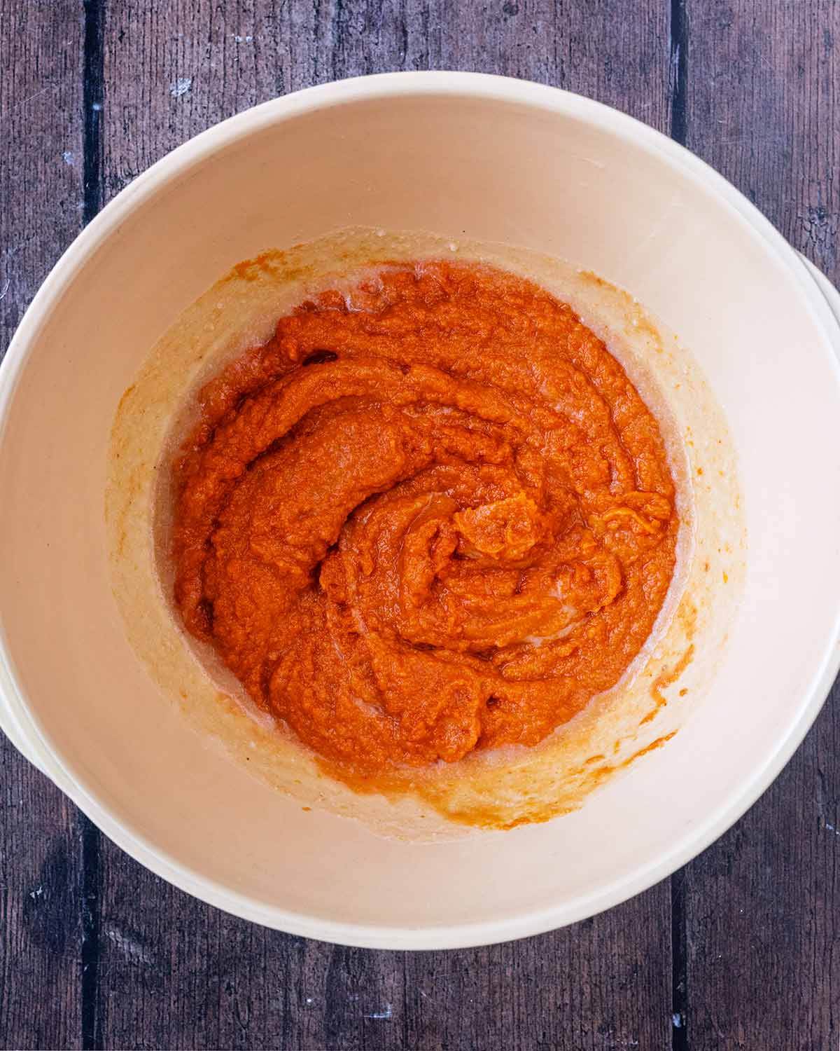 Pumpkin puree added to the bowl.