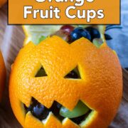 Jack-O-Lantern Orange Fruit Cups with a text overlay title.