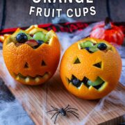 Jack-O-Lantern Orange Fruit Cups with a text overlay title.