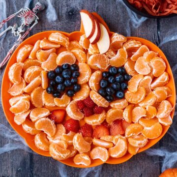 A Halloween Fruit Tray on a wooden surface.