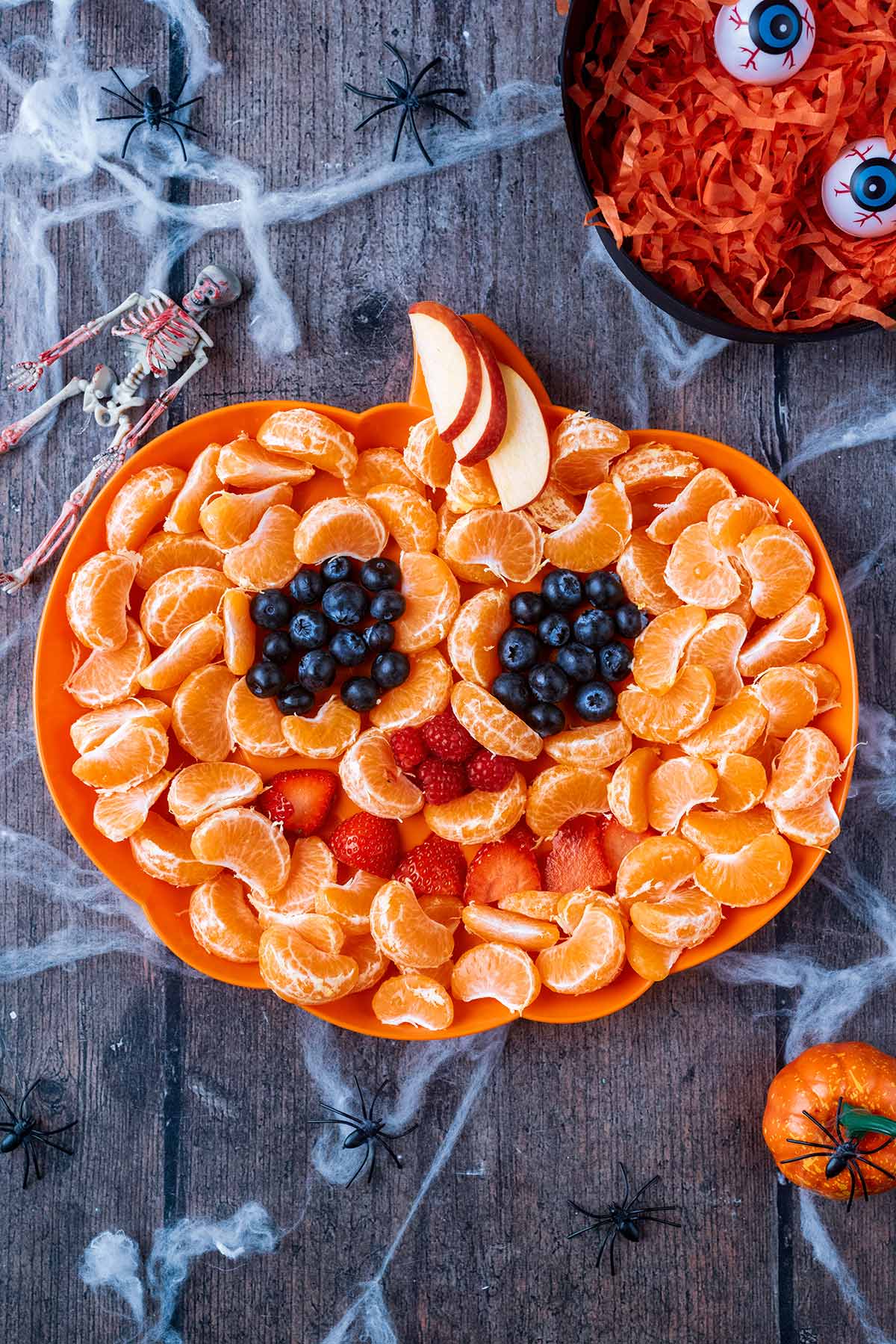 A fruit platter made into the shape of a Jack O' Lantern.