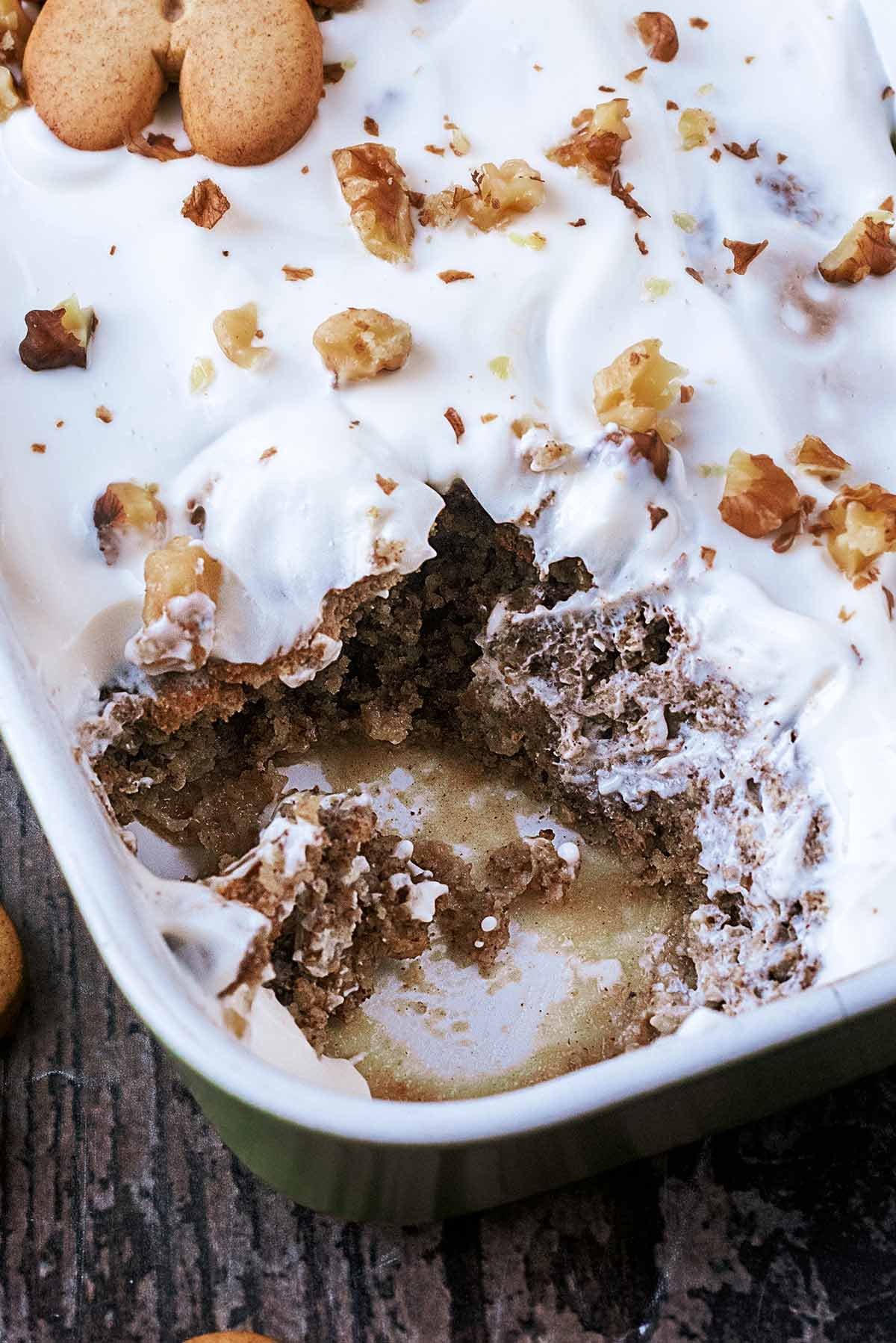 Baked oats in a baking dish with a portion removed.