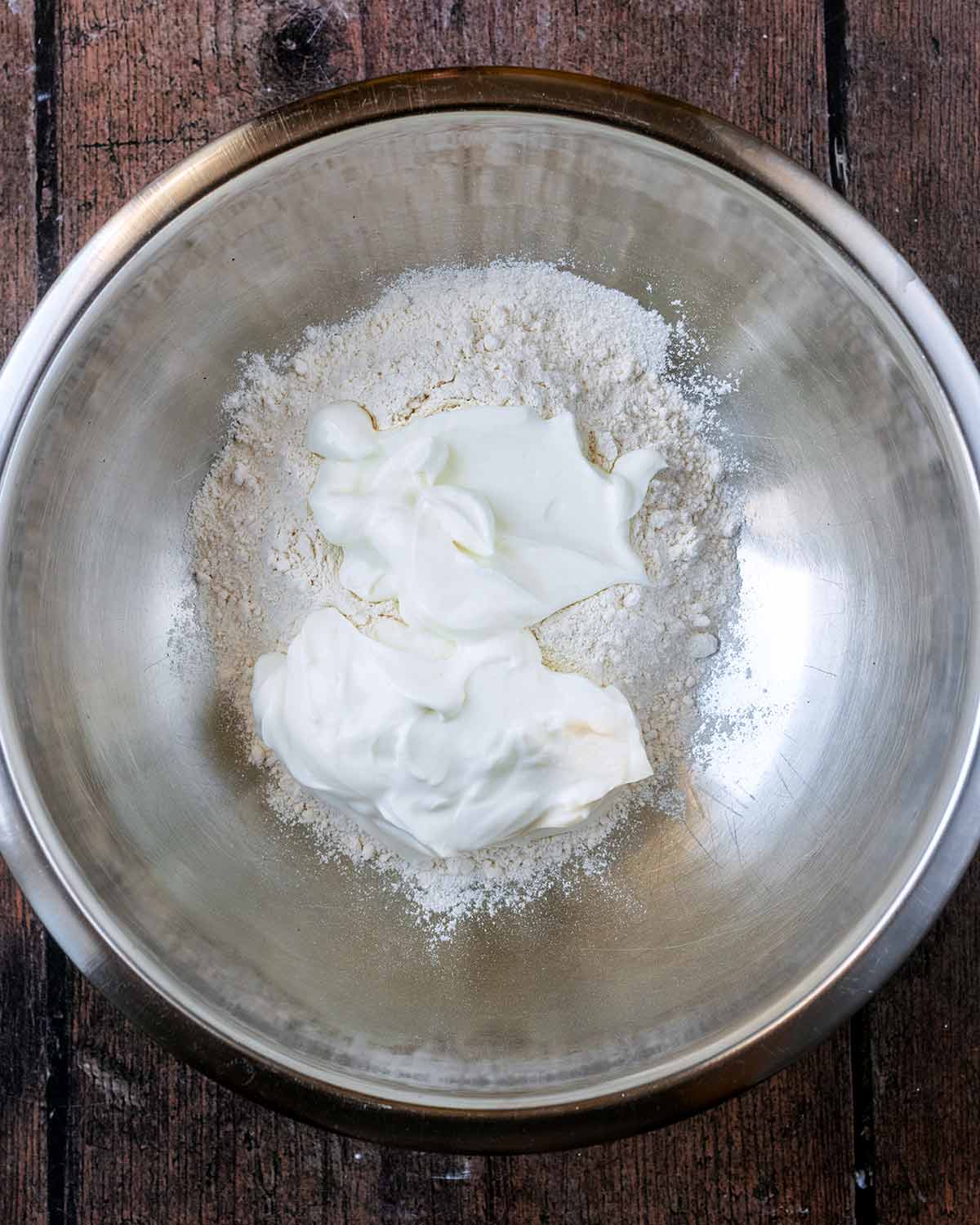 Flour and yogurt in a mixing bowl.