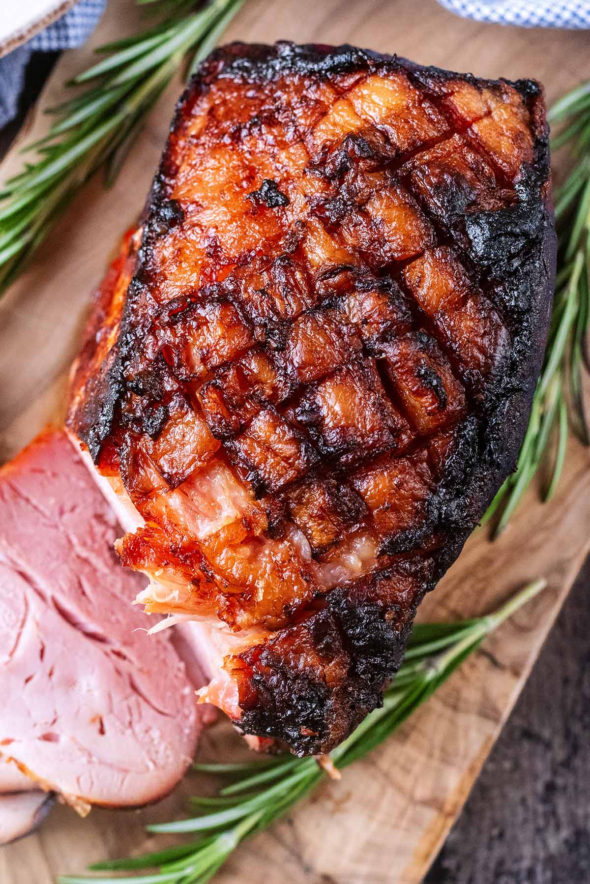 Cooked ham joint with a diamond pattern cut in the top.