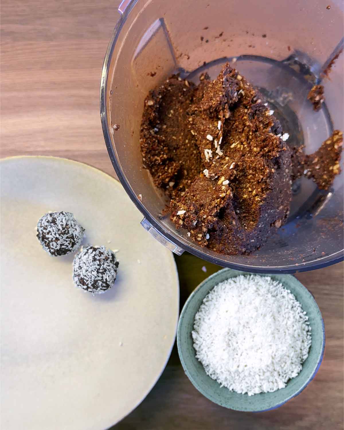 Two small balls made from the mixture and coated in desiccated coconut.