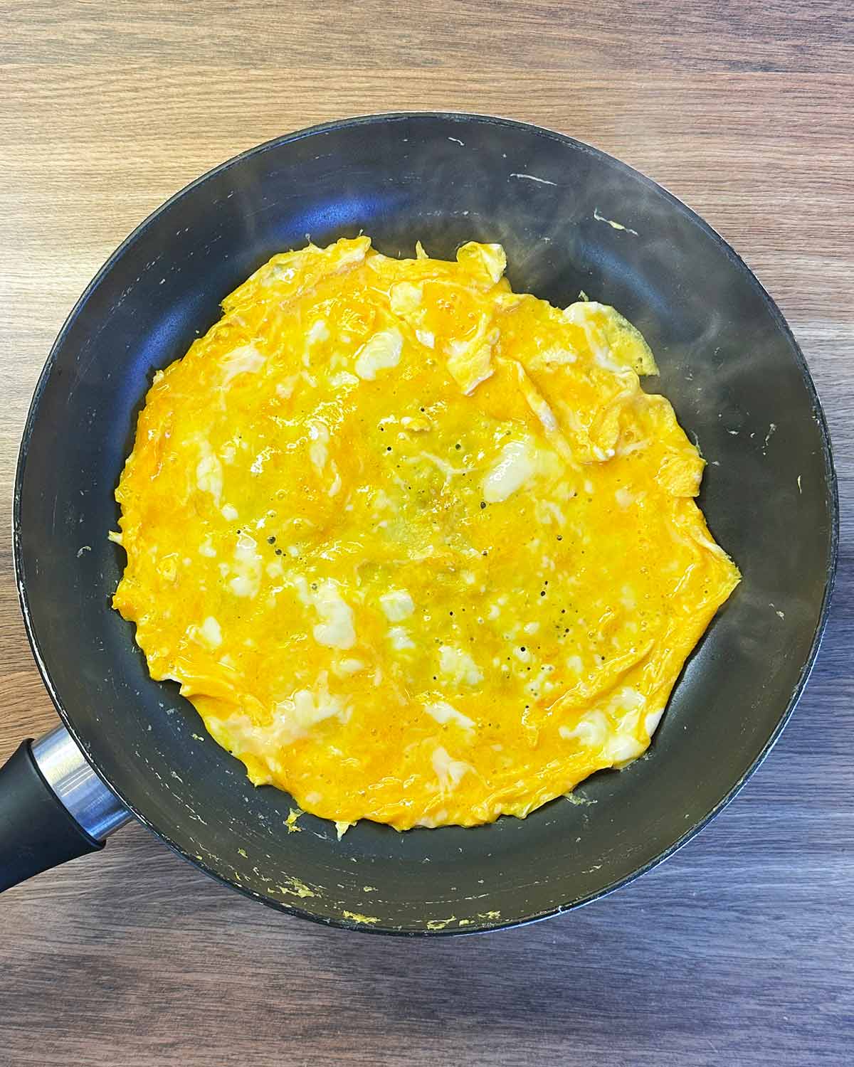 Cooked omelette in a frying pan.