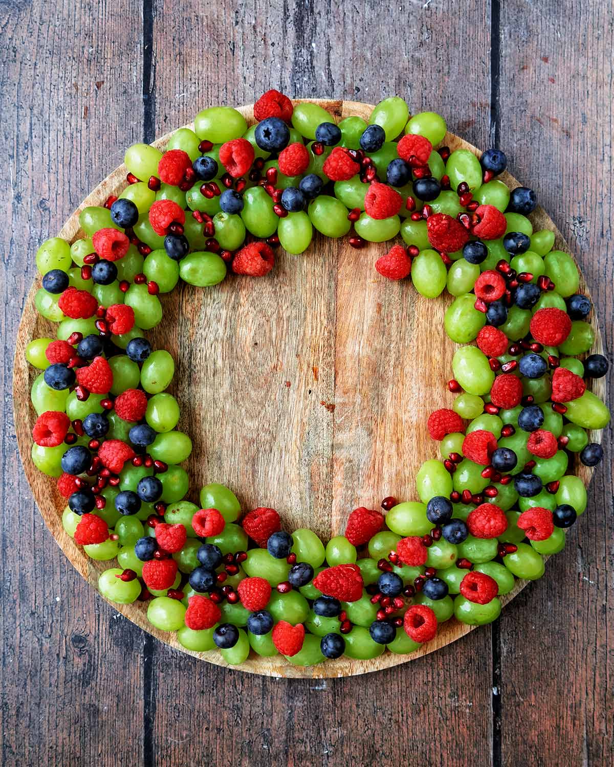 Pomegranate seeds scattered over the fruit.