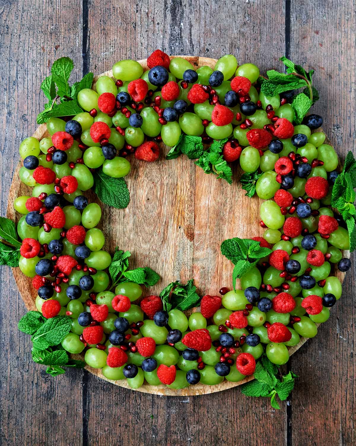 Mint leaves pushed into the edges of the grape ring.