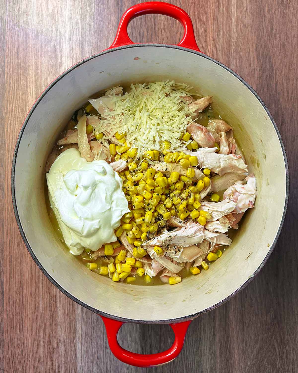 Cream, sweetcorn, cheese and seasoning added to the pan.