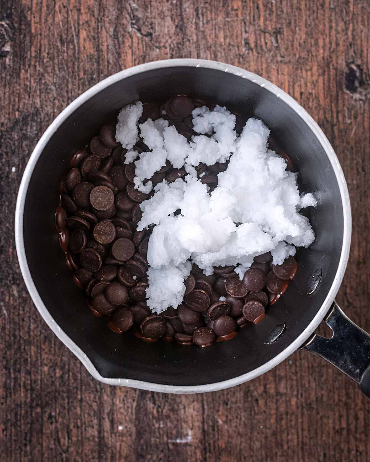 Chocolate chips and coconut oil in a small saucepan.