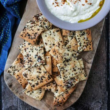 Homemade crackers on a wooden board.