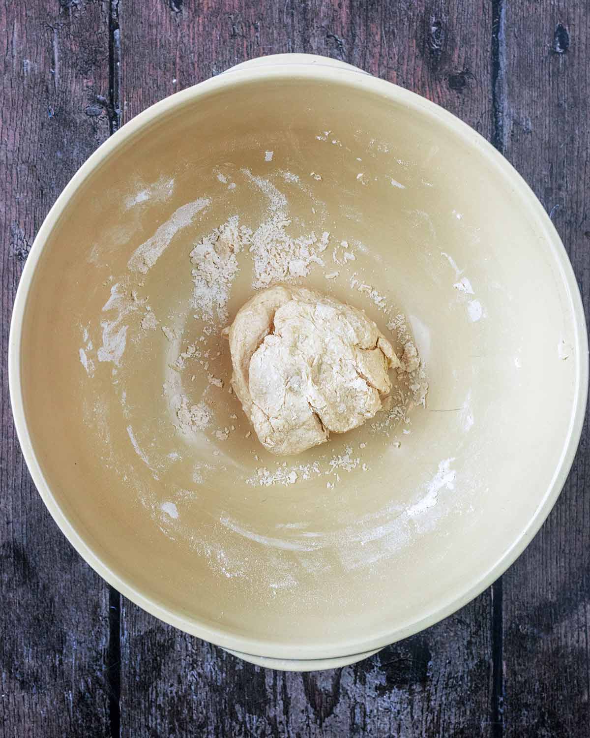 A ball of dough in the mixing bowl.