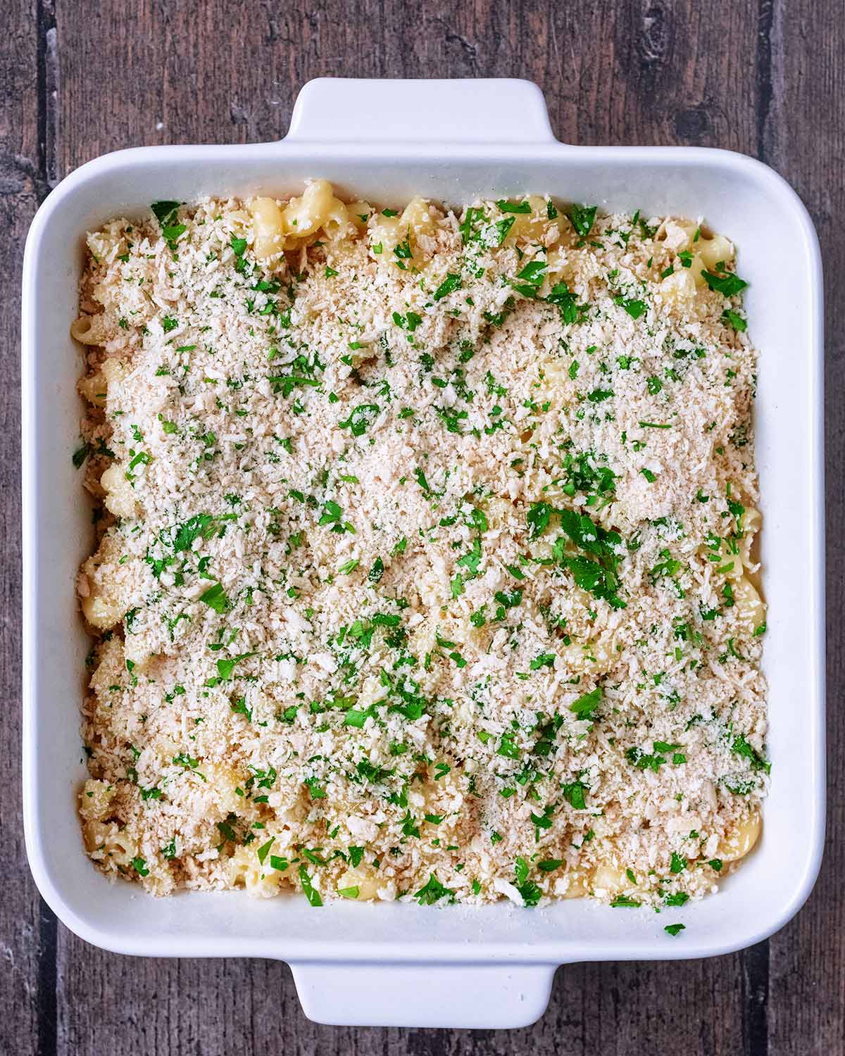 The macaroni and cheese sauce topped with the breadcrumb mixture.