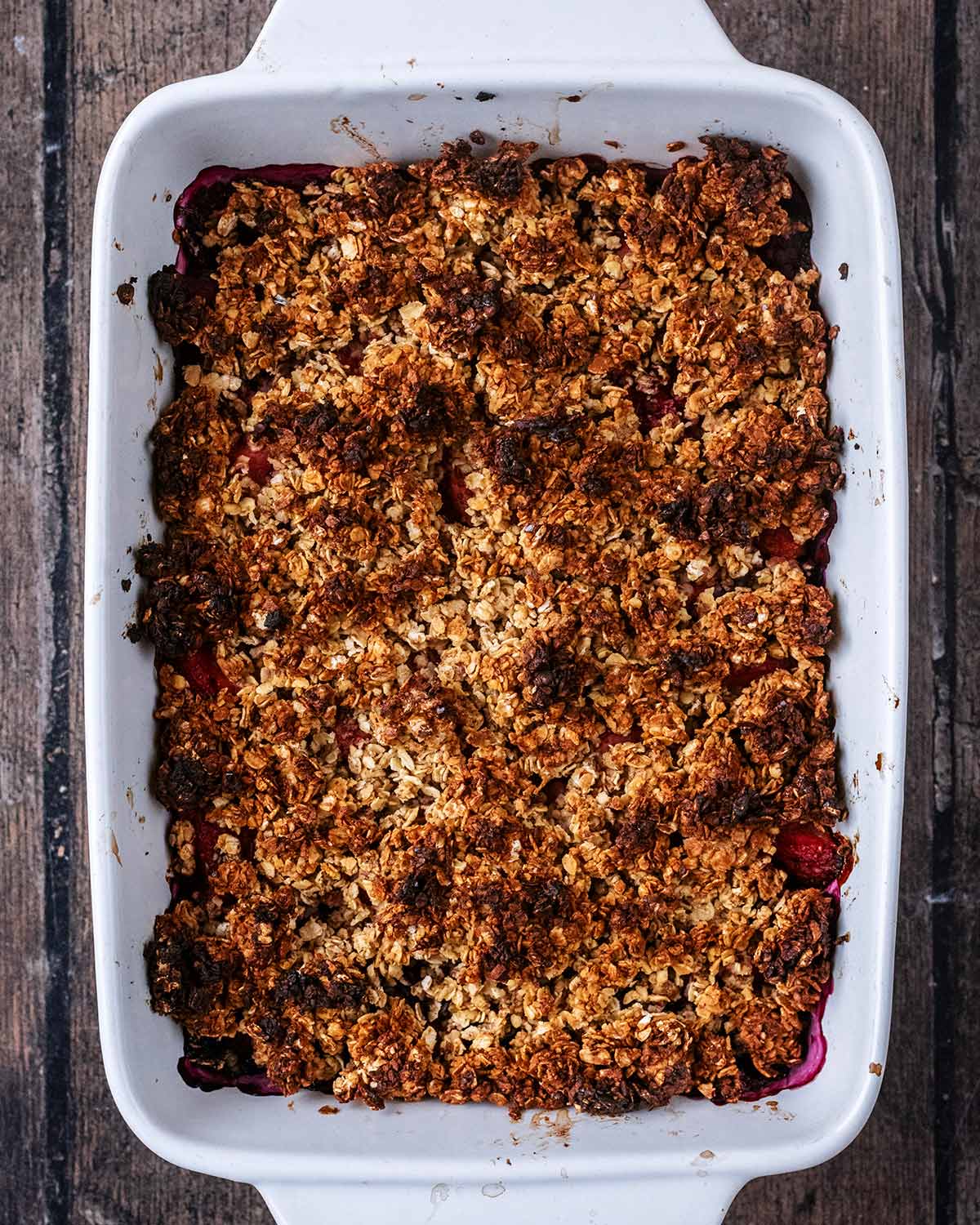 Cooked berry crumble with a slightly blackened top.