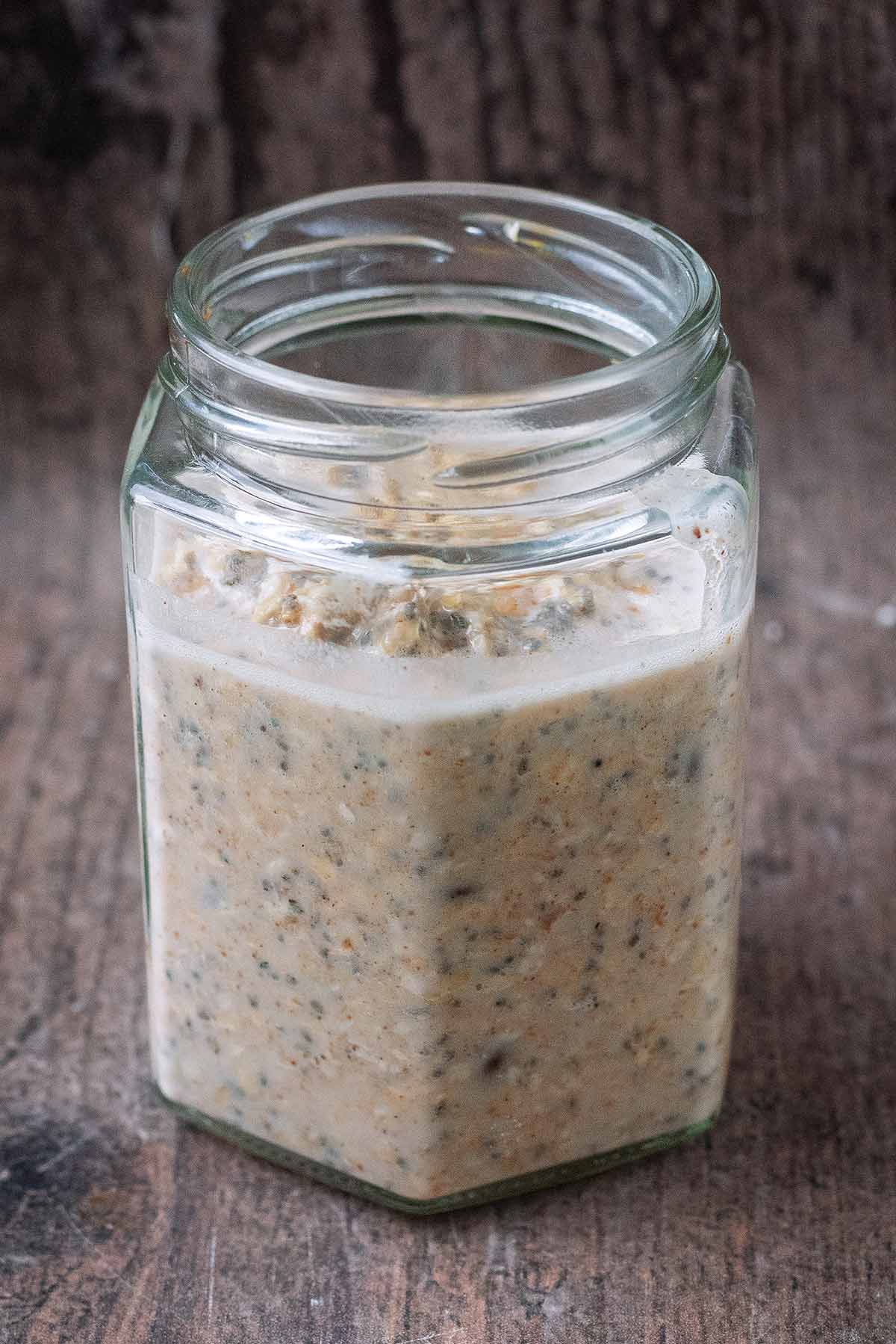 Un-chilled overnight oats in a glass jar.