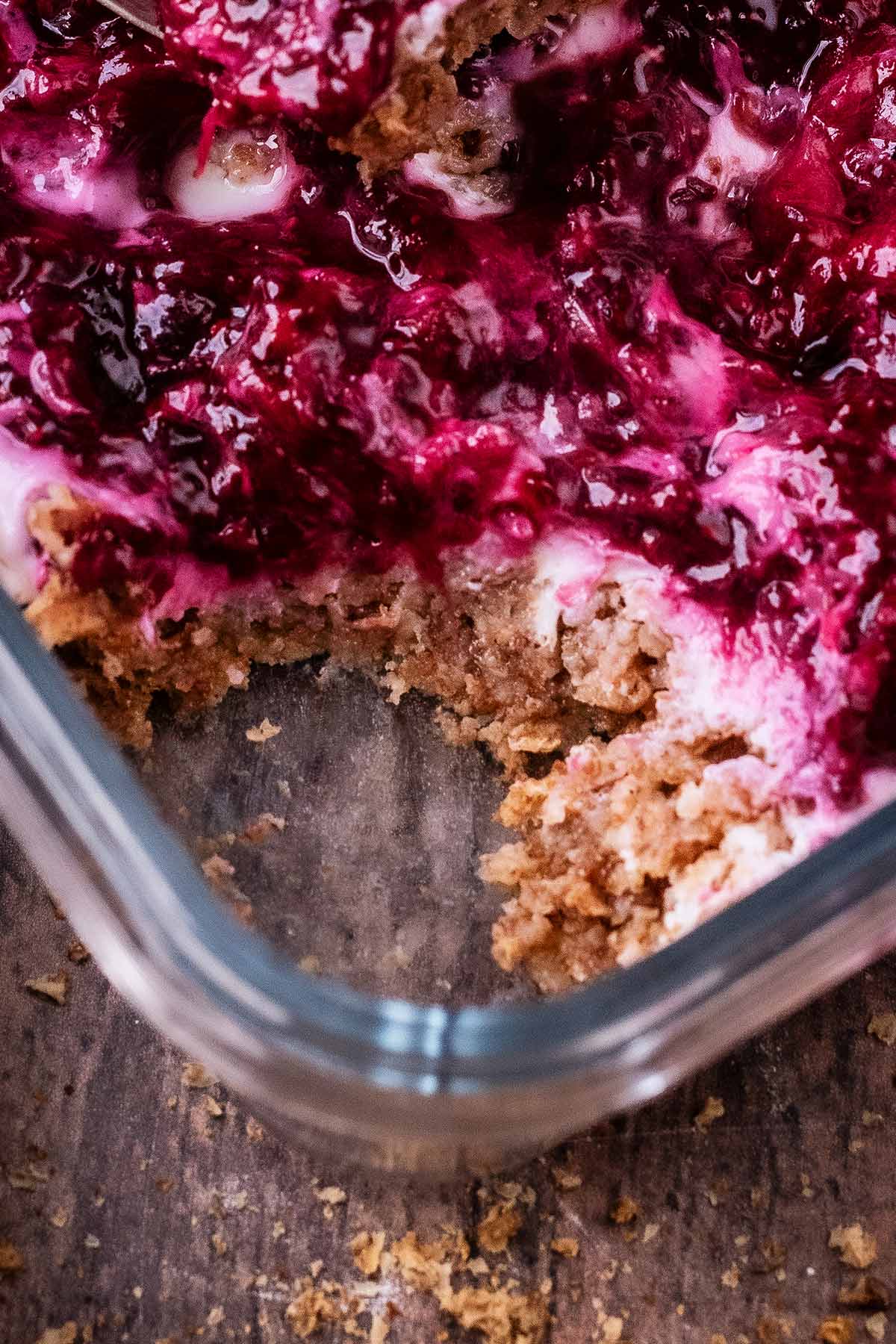 A bowl of overnight Weetabix with a portion removed.