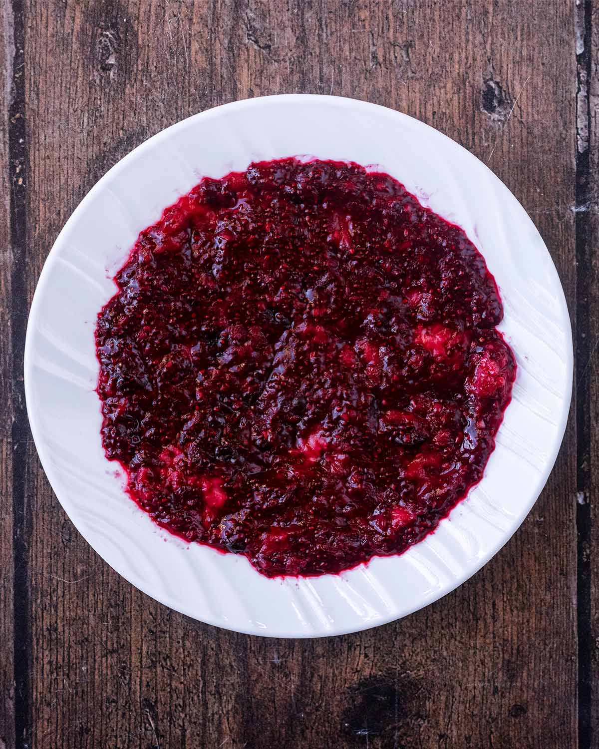 Homemade jam spread over a white plate.