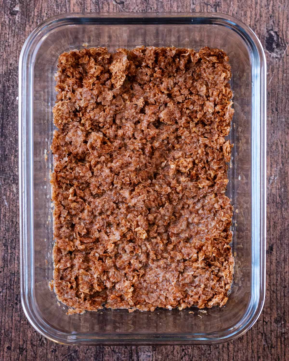 Soaked Weetabix in a rectangular glass bowl.