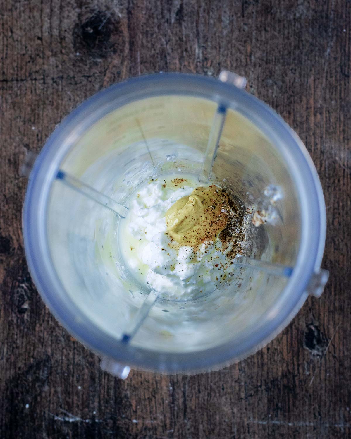 Cottage cheese, mustard, lemon juice, salt and pepper in a blender jug.