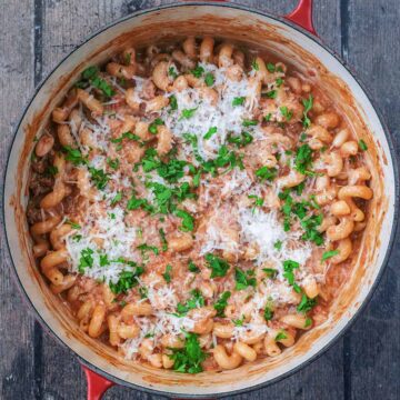 A large cooking pot full of creamy beef pasta.