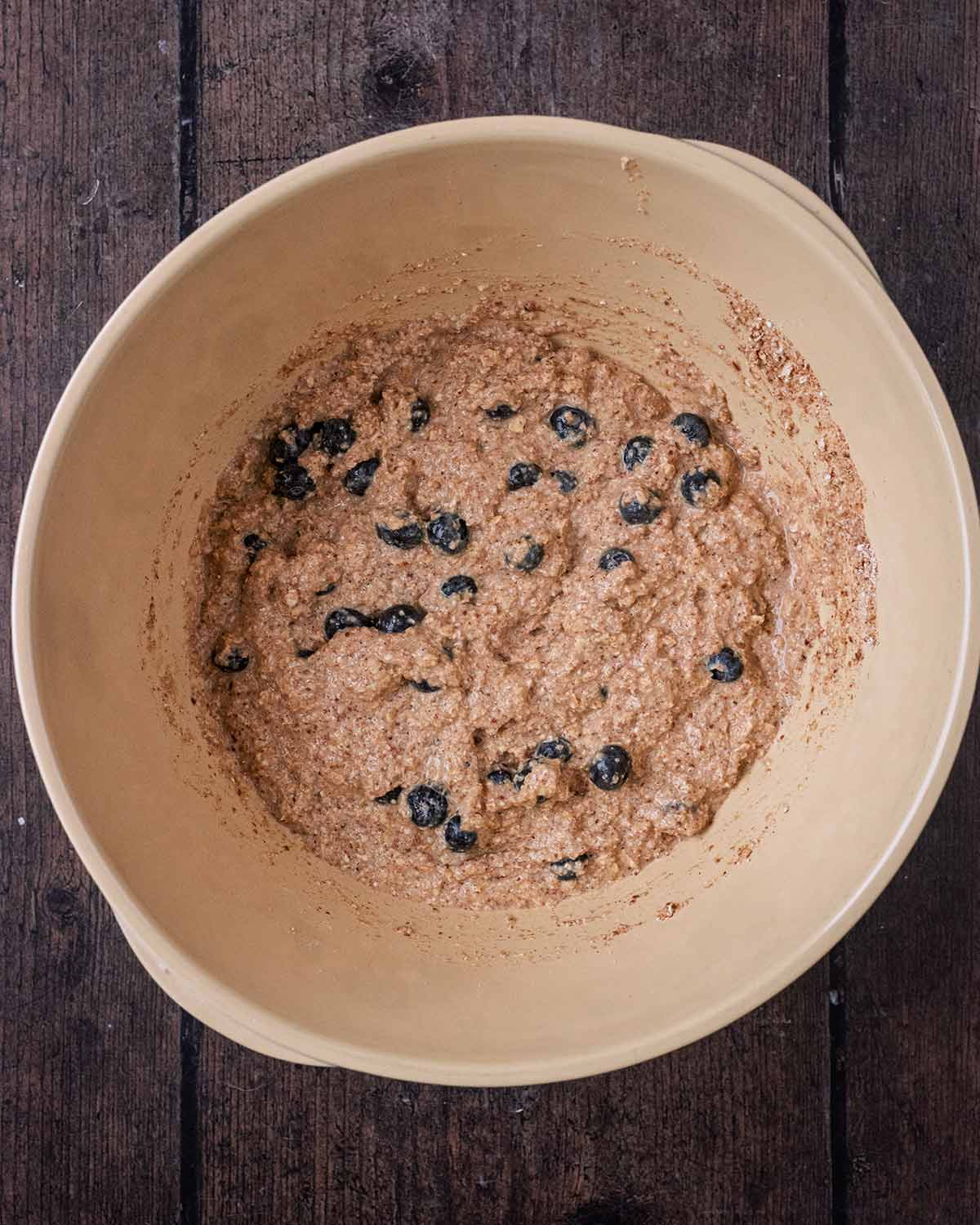 The wet and dry ingredients mixed together with some blueberries added.