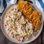 Cottage cheese tuna salad on a plate with some square crackers.