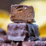 Chocolate Date Caramels stacked up in a tower.